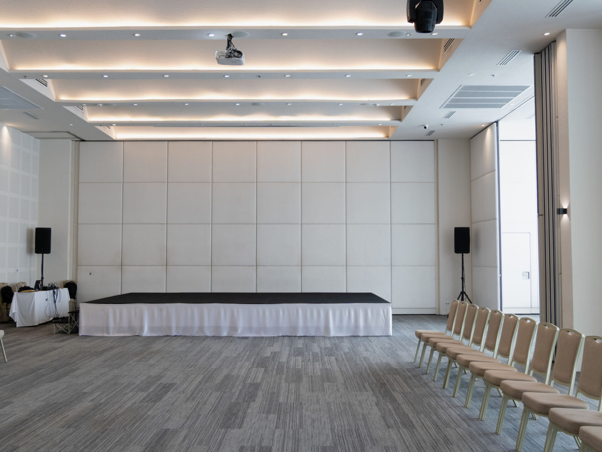 A spacious well-lit conference hall set up for impactful business events.